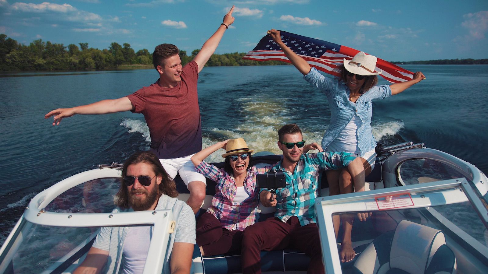 Friends Having Fun Boating, With American Flag